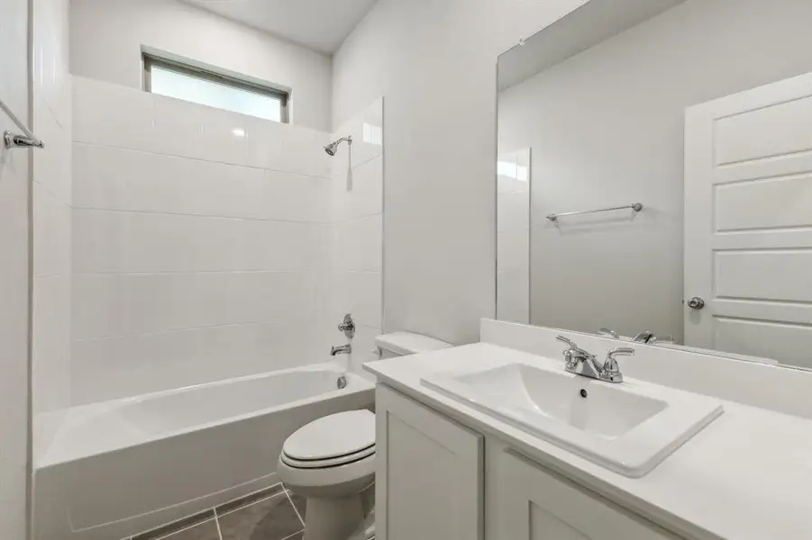 Bathroom in the Cedar home plan by Trophy Signature Homes – REPRESENTATIVE PHOTO