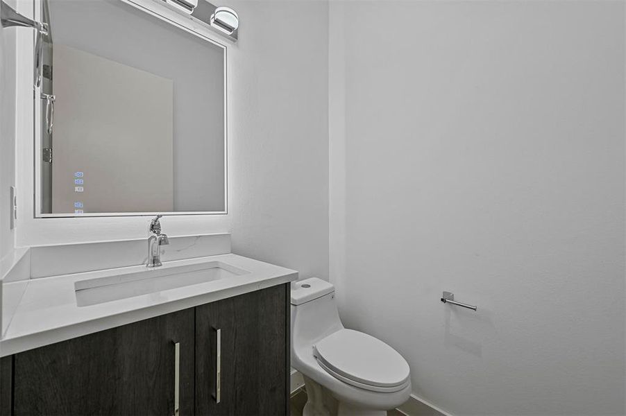 Bathroom with vanity and toilet