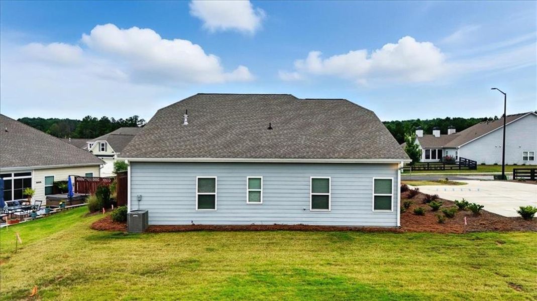 Front exterior of a new home in Heritage Pointe at The Georgian, Villa Rica, GA, highlighting curb appeal (Image 1). Front exterior of a new home in Heritage Pointe at The Georgian, Villa Rica, GA, highlighting curb appeal (Image 1).