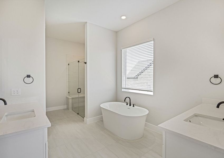 The master bathroom has two large vanity spaces.