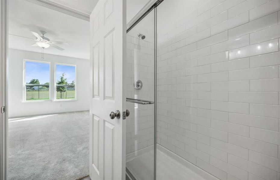 Oversized shower in owner's bath *real home pictured