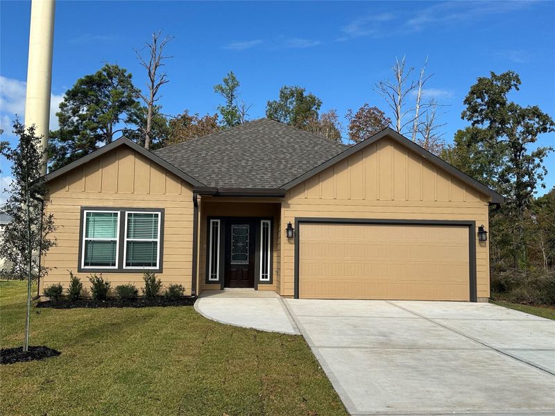 Front exterior of a new home in , Livingston, TX, highlighting curb appeal (Image 1).