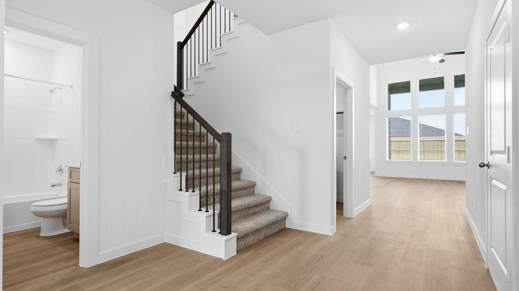 Spacious entry foyer with grand staircase leading to the second floor