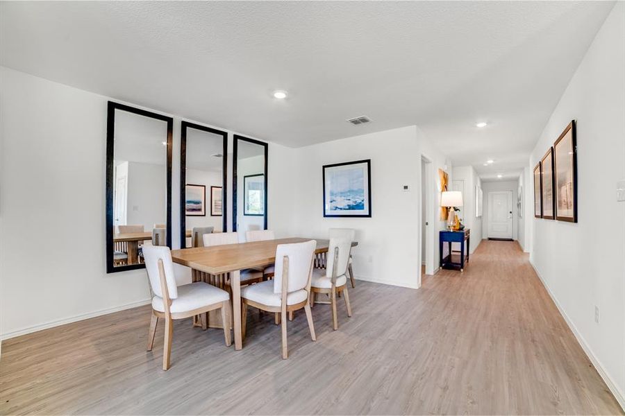 Dining area featuring light wood-style floors and recessed lighting Dining area featuring light wood-style floors and recessed lighting