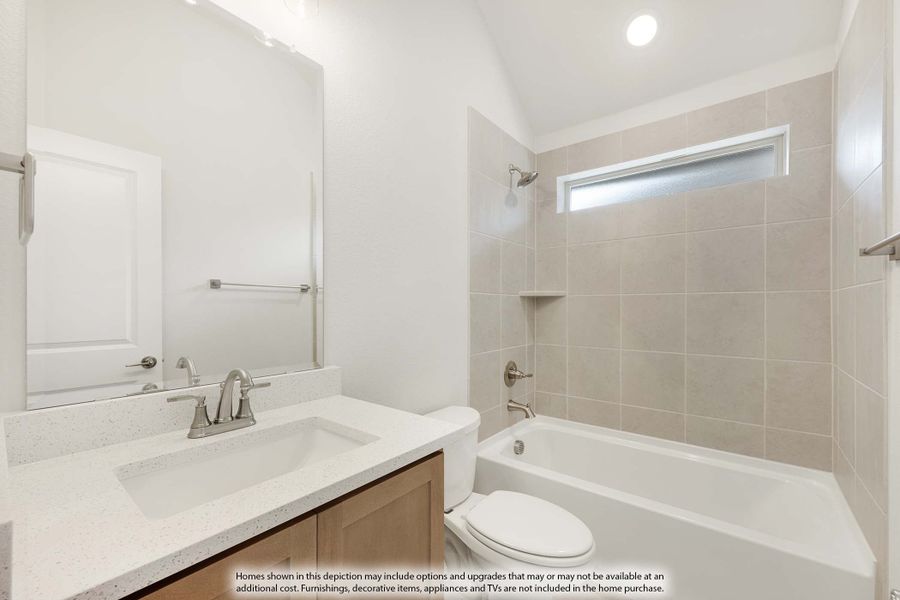 Bathroom with quartz vanity, wood cabinets, tub-shower combo with beige tile surround, and small window Bathroom with quartz vanity, wood cabinets, tub-shower combo with beige tile surround, and small window