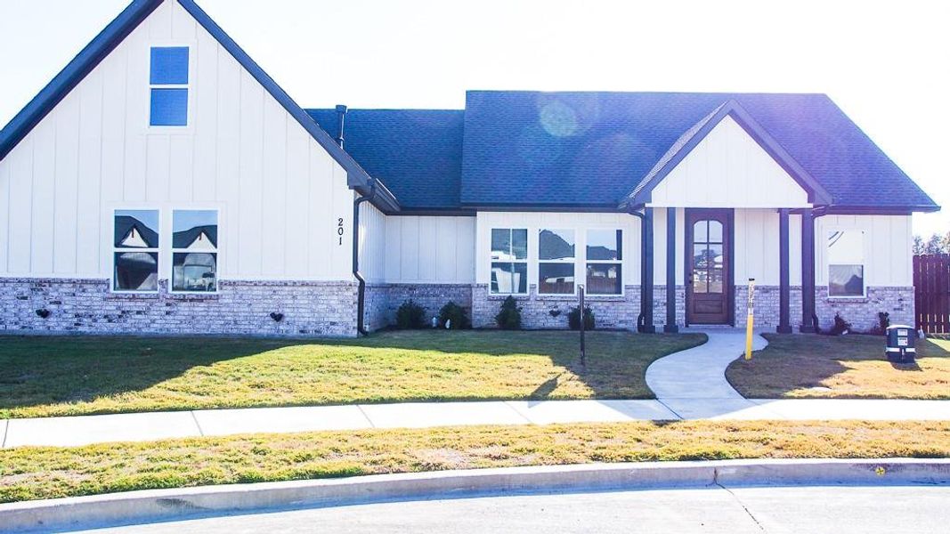 Front exterior of a new home in , Godley, TX, highlighting curb appeal (Image 1). Front exterior of a new home in , Godley, TX, highlighting curb appeal (Image 1).