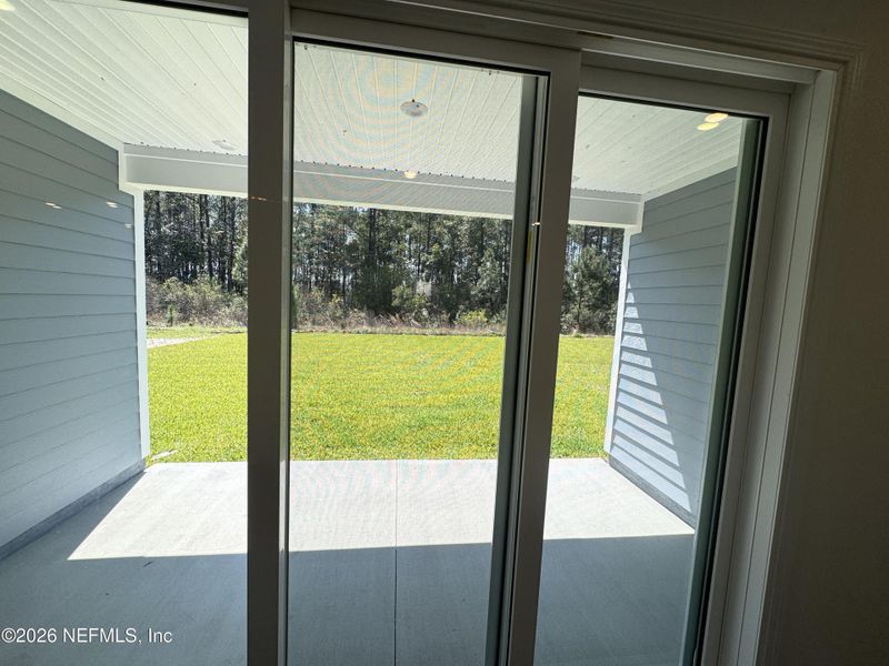Exterior details and patio area of a home in Hyland Trail, Green Cove Springs (Image 3).
