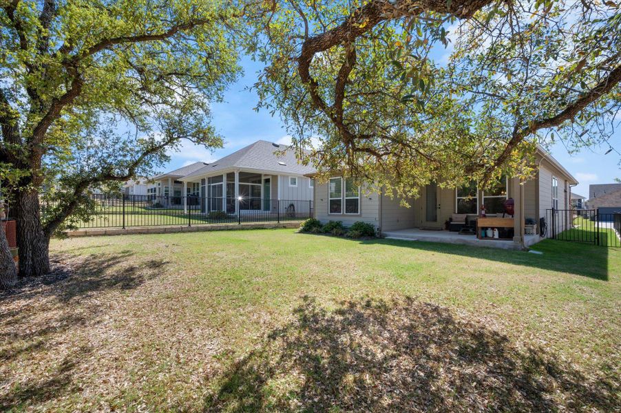 Back of house with a fenced backyard and a patio, Huge trees for privacy Back of house with a fenced backyard and a patio, Huge trees for privacy