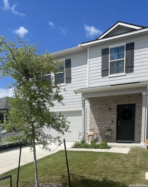 Front exterior of a new home in Park Place, New Braunfels, TX, highlighting curb appeal (Image 1). Front exterior of a new home in Park Place, New Braunfels, TX, highlighting curb appeal (Image 1).