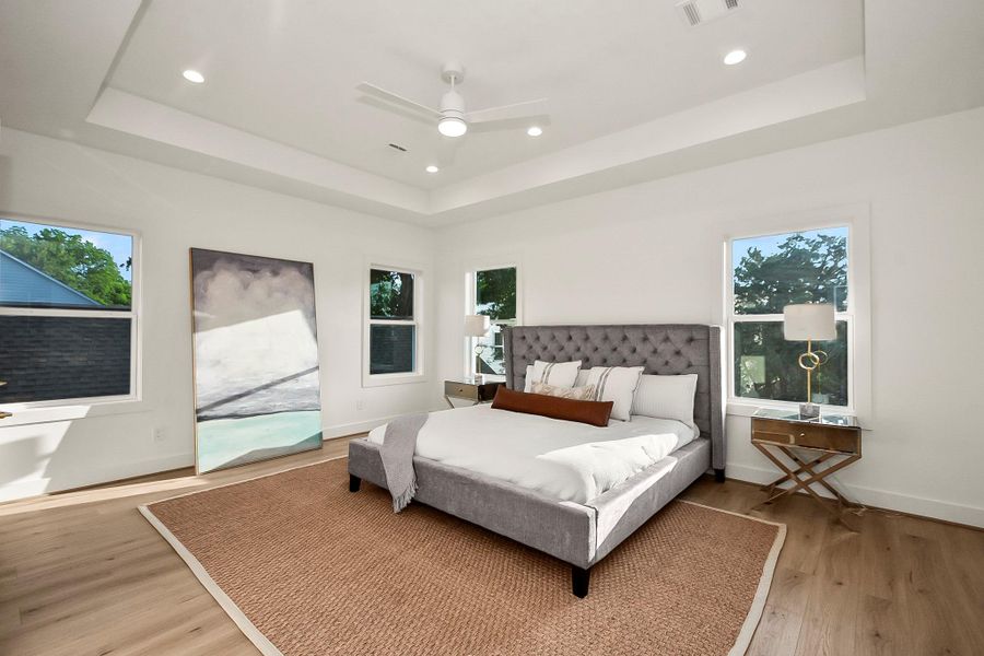 The primary suite provides a peaceful retreat with generous proportions, abundant natural light, and a spa-inspired ensuite bathroom.