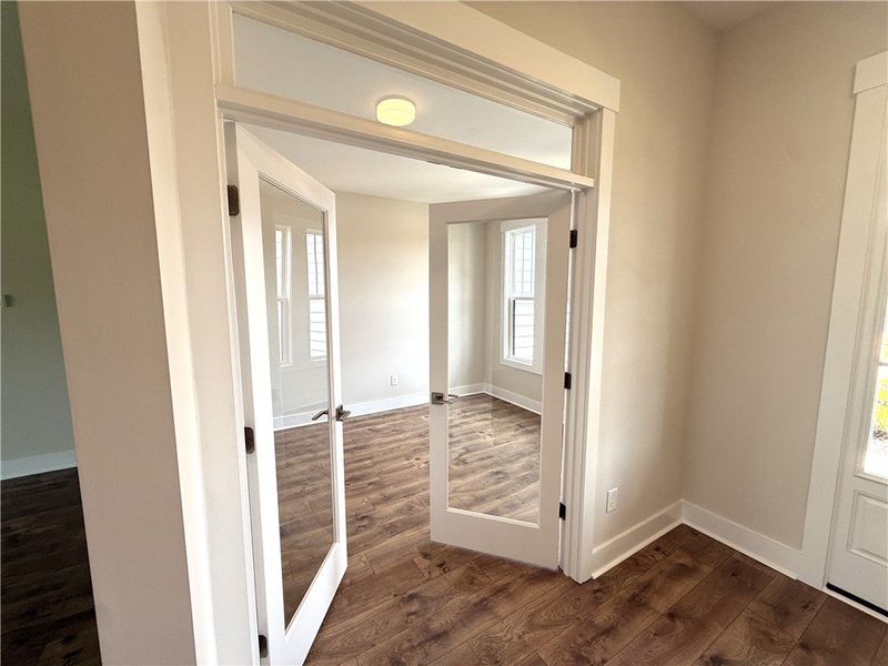 French doors open into a bright, versatile study w French doors open into a bright, versatile study w