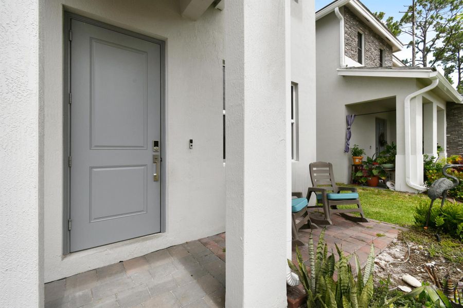 Front exterior of a new home in Reserve at Jupiter, Jupiter, FL, highlighting curb appeal (Image 29).