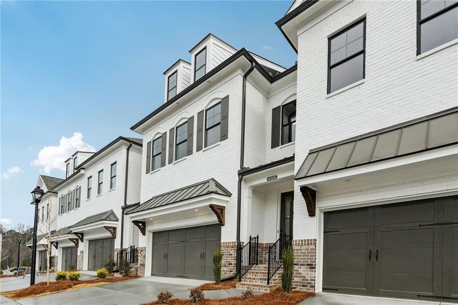 Front exterior of a new home in Millcroft Townhomes, Buford, GA, highlighting curb appeal (Image 2). Front exterior of a new home in Millcroft Townhomes, Buford, GA, highlighting curb appeal (Image 2).