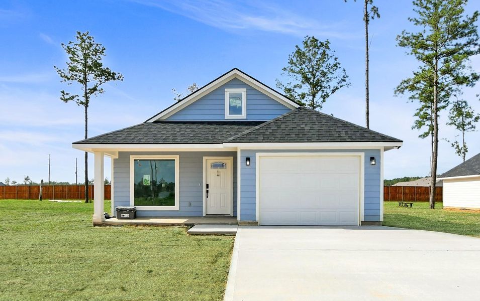 Front exterior of a new home in , Conroe, TX, highlighting curb appeal (Image 1). Front exterior of a new home in , Conroe, TX, highlighting curb appeal (Image 1).