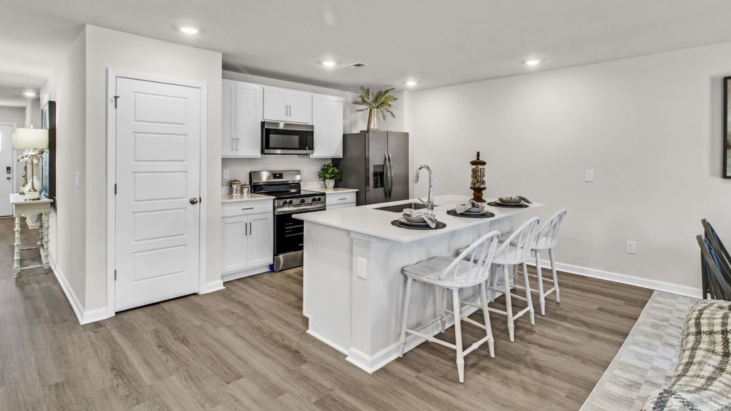 Representative furnished interior of a home built from the Freeport by D.R. Horton in Bailey Park, Fayetteville (Image 17).