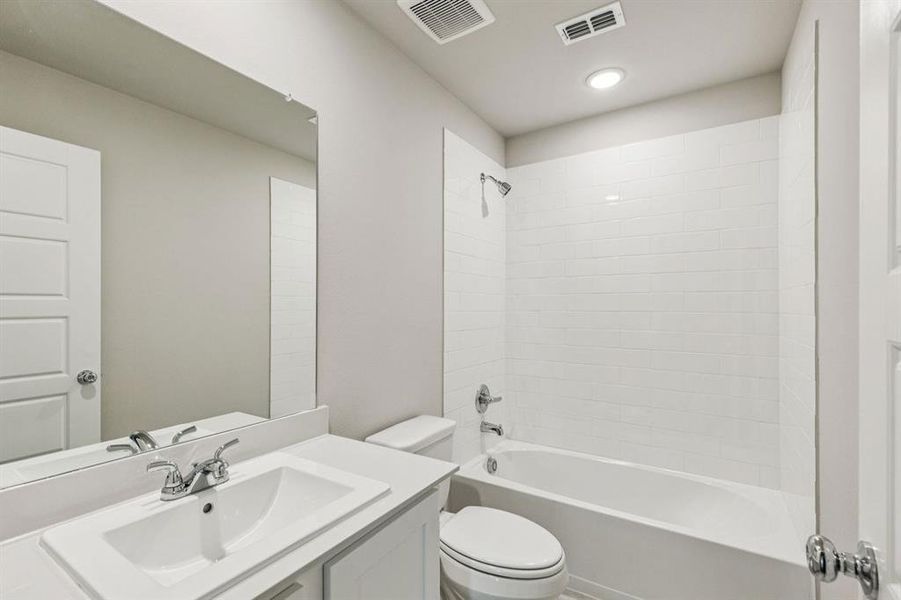 Bathroom in the Harper home plan by Trophy Signature Homes – REPRESENTATIVE PHOTO