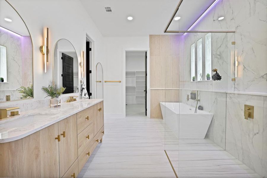 Bathroom featuring vanity and plus walk in shower