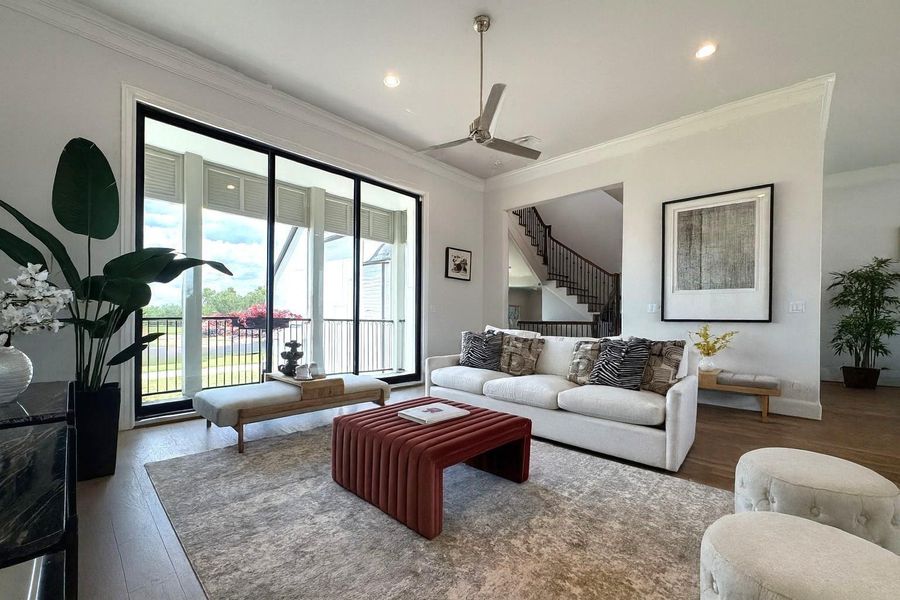 Massive 10' tall tri-fold sliding glass doors flood the living area with natural light.