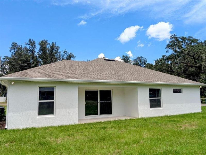 Front exterior of a new home in , Fort Meade, FL, highlighting curb appeal (Image 14).