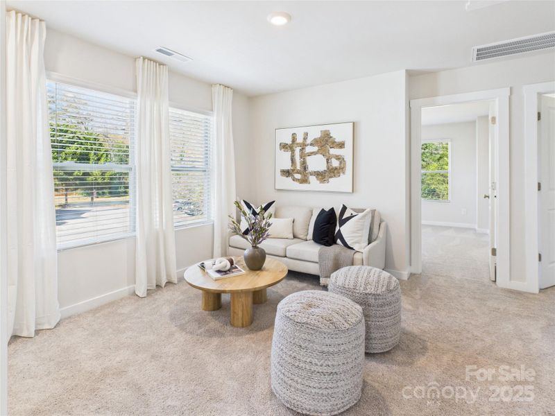 View of loft with secondary bedrooms at the back.
