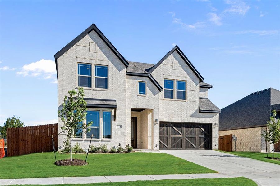 Front exterior of a new home in The Retreat at North Grove 60, Waxahachie, TX, highlighting curb appeal (Image 1).