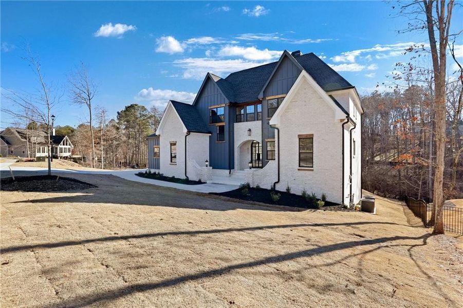 Front exterior of a new home in , Gainesville, GA, highlighting curb appeal (Image 32).