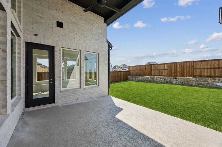 Dining al fresco is in your future on this over the top covered back patio! Dining al fresco is in your future on this over the top covered back patio!