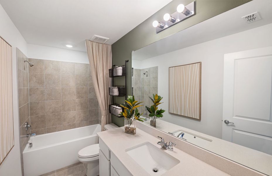 Representative furnished interior of a home built from the McNair by Centex in Whispering Lakes, Lehigh Acres (Image 28).