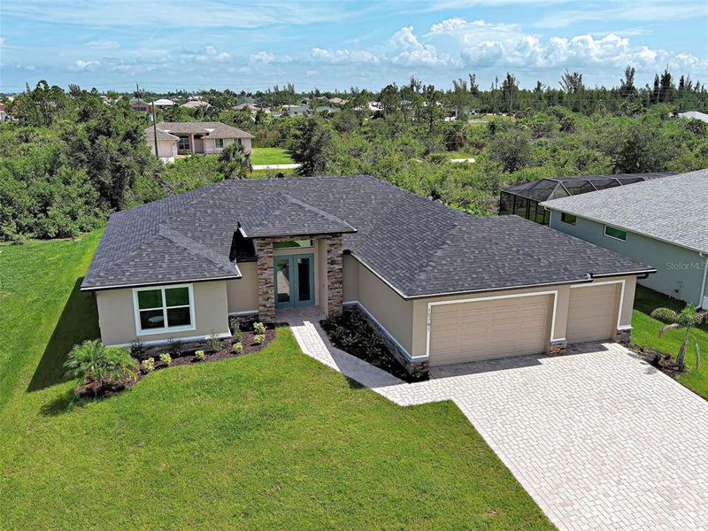 Front exterior of a new home in , Port Charlotte, FL, highlighting curb appeal (Image 26).