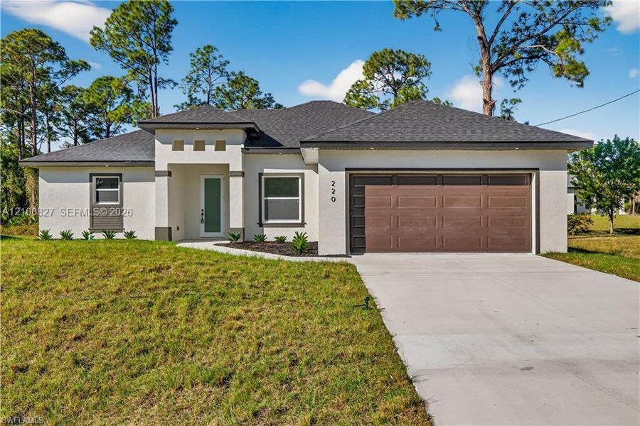 Front exterior of a new home in , Lehigh Acres, FL, highlighting curb appeal (Image 1). Front exterior of a new home in , Lehigh Acres, FL, highlighting curb appeal (Image 1).