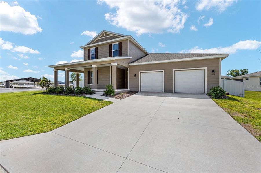 Front exterior of a new home in Calesa Township, Ocala, FL, highlighting curb appeal (Image 26). Front exterior of a new home in Calesa Township, Ocala, FL, highlighting curb appeal (Image 26).