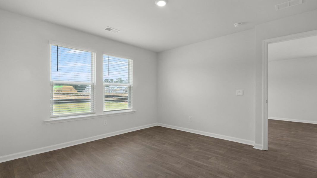Spacious, unfurnished interior of a new home in Pine Hills Townhomes at Cane Bay, Summerville (Image 20).