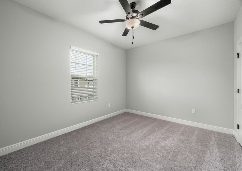 Each bedroom has faux wood blinds on the window