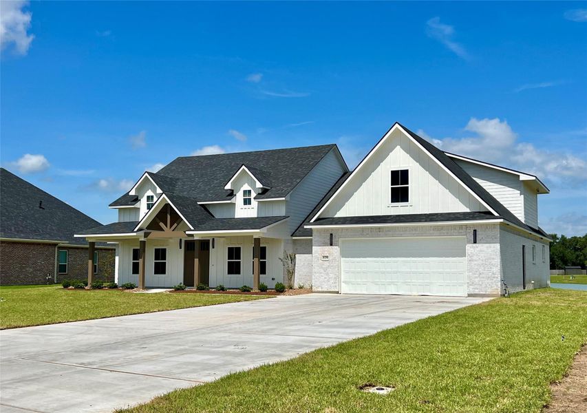Front exterior of a new home in , Angleton, TX, highlighting curb appeal (Image 17).