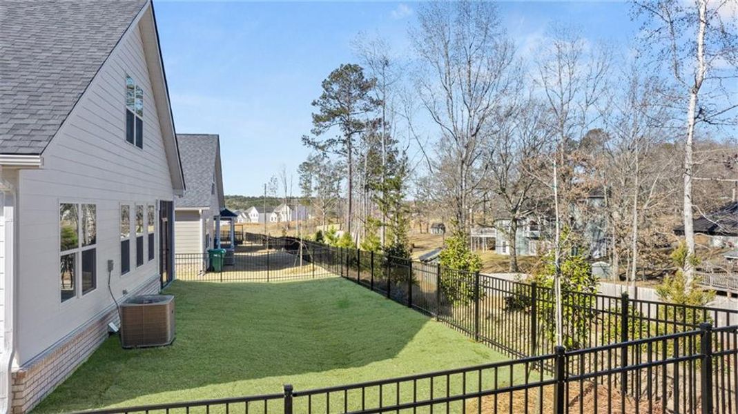 Exterior details and patio area of a home in Oak Ridge Meadows - Active Adult, Locust Grove (Image 23).