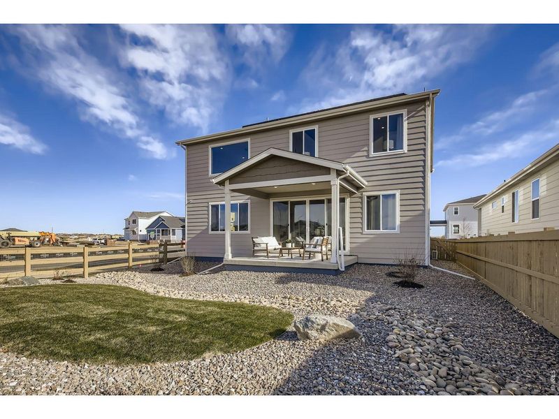 Exterior details and patio area of a home in Farmstead, Berthoud (Image 24).