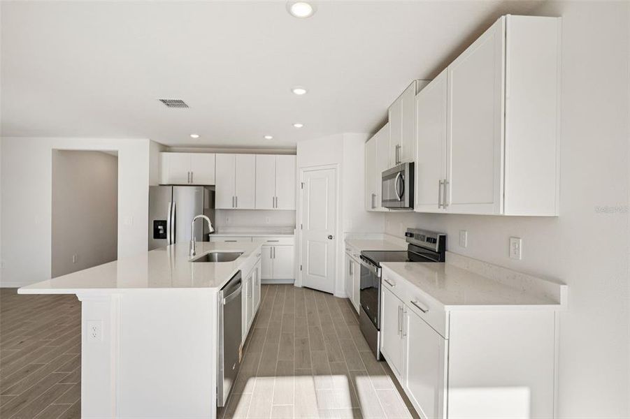 Furnished interior view inside a new home in The Grove at Stuart Crossing - Classic Series, Bartow (Image 13).