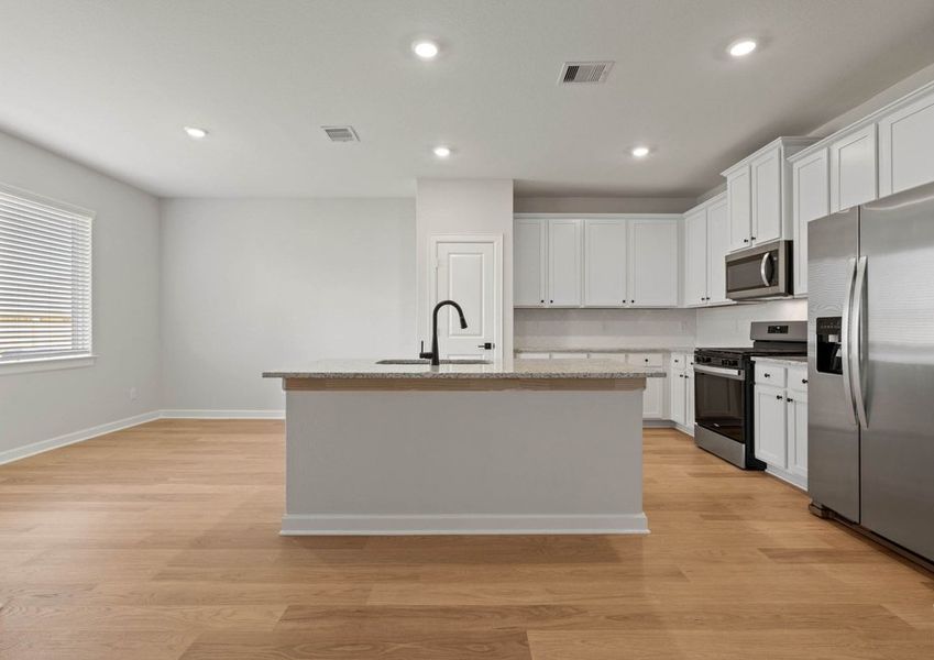 Kitchen with stainless steel applainces.