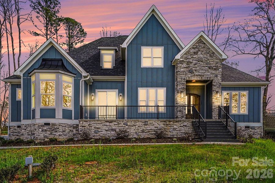 Front exterior of a new home in , Troutman, NC, highlighting curb appeal (Image 28).