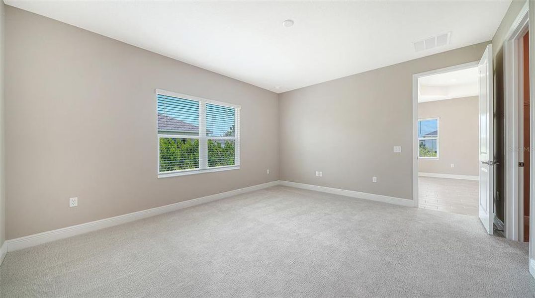 Spacious, unfurnished interior of a new home in Wildleaf at North River Ranch, Parrish (Image 33).