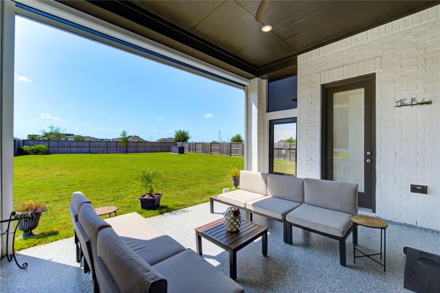 Retractable Shades Open to Reveal the Expansive Backyard Oasis