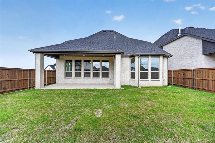 Exterior details and patio area of a home in Cambridge Crossing, Celina (Image 18).