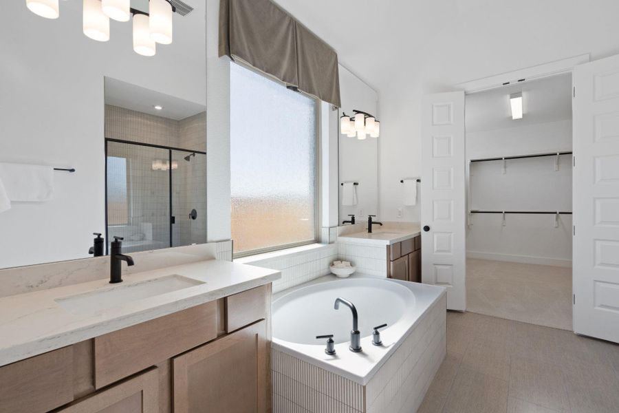 Primary Bath retreat with dual vanities & garden tub - Representative Photo