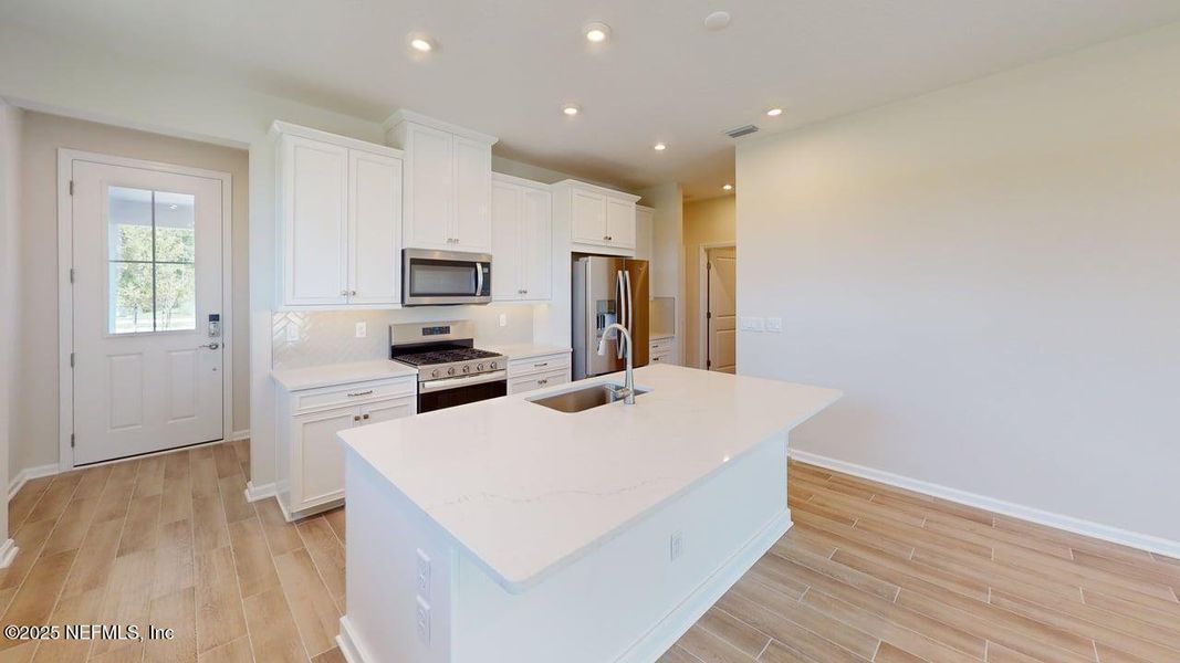 Furnished interior view inside a new home in RiverTown - WaterSong, St. Johns (Image 7).