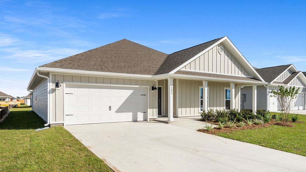 Front exterior of a new home in Titus Park, Panama City, FL, highlighting curb appeal (Image 1).