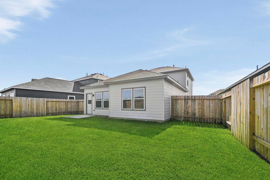 Exterior details and patio area of a home in Barrett Crossing, Crosby (Image 3).