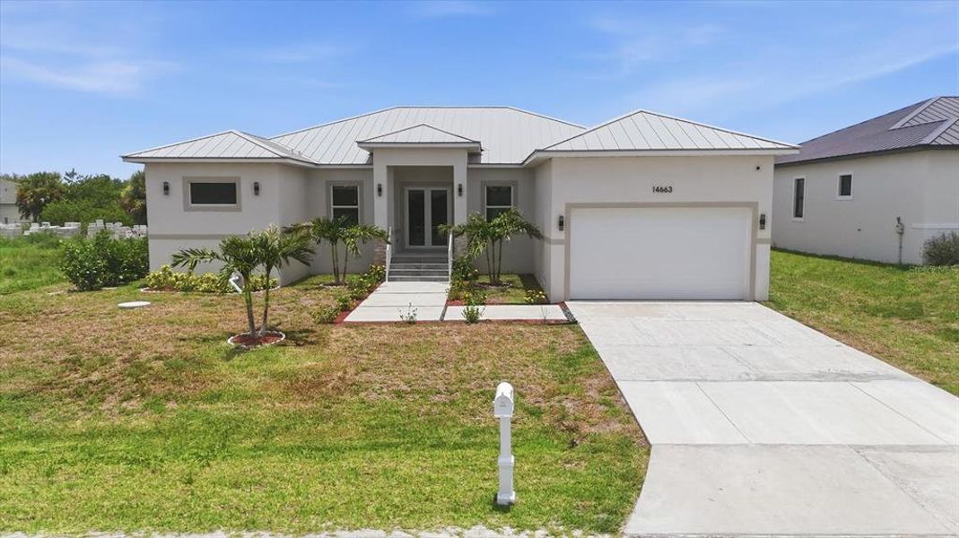Front exterior of a new home in , Port Charlotte, FL, highlighting curb appeal (Image 1). Front exterior of a new home in , Port Charlotte, FL, highlighting curb appeal (Image 1).