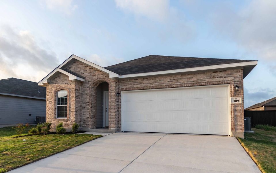Front exterior of a new home in Hannah Heights, Seguin, TX, highlighting curb appeal (Image 2).