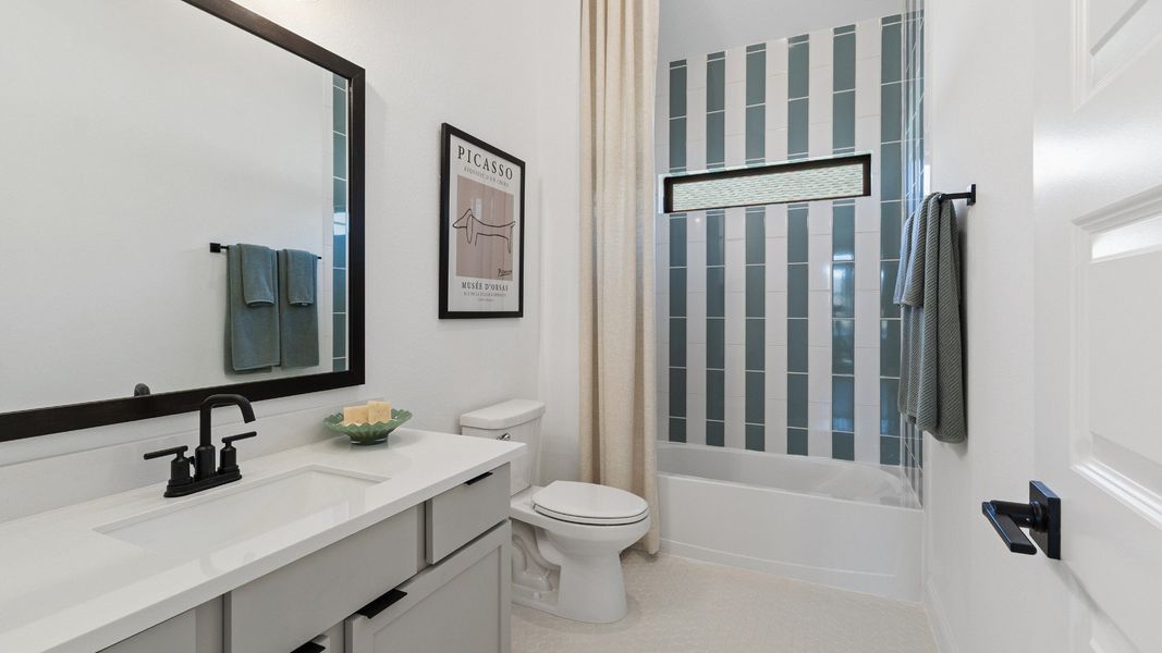 Representative furnished interior of a home built from the Oleander by Brightland Homes in Sunterra, Katy (Image 17).