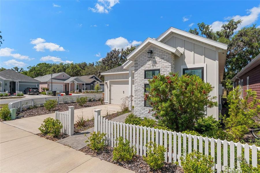 Front exterior of a new home in Fairway Pointe at West End, Newberry, FL, highlighting curb appeal (Image 29).